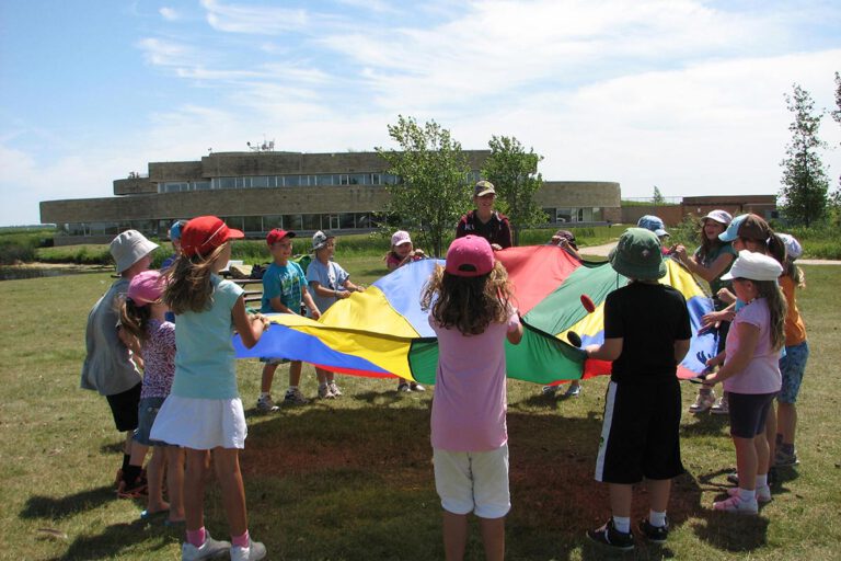 Students outside playing with interpreter.